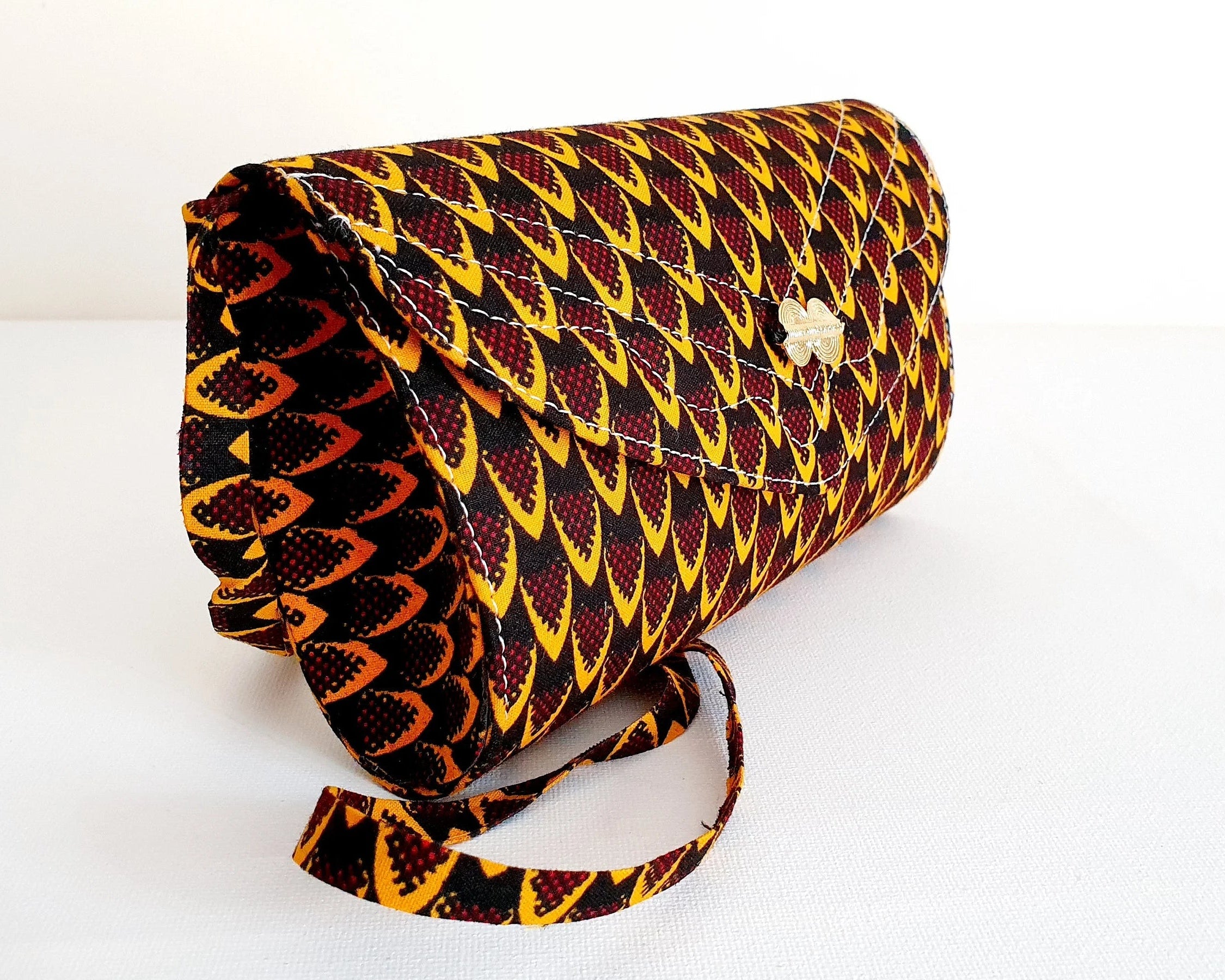 Patterned clutch bag on a white background