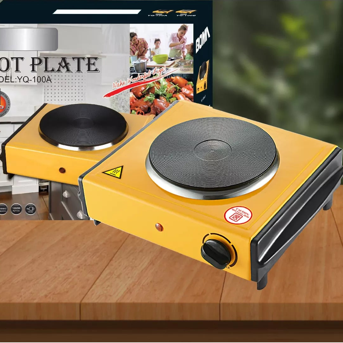 Yellow hot plate with packaging on a wooden surface