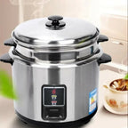 Stainless steel pressure cooker with a digital display on a neutral background