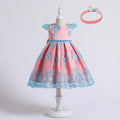 Pink dress with blue floral patterns on a mannequin, accompanied by a matching headband.