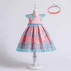 Pink dress with blue floral patterns on a mannequin, accompanied by a matching headband.