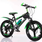 Green and black children's bicycle on a white background