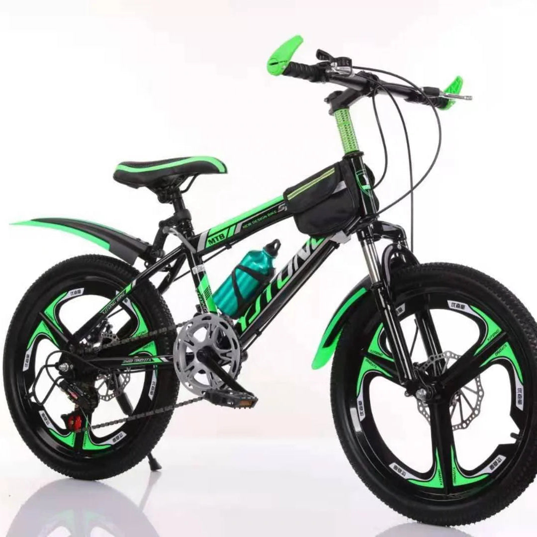 Green and black children's bicycle on a white background