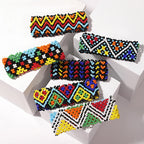 Colorful beaded hair clips on a white background