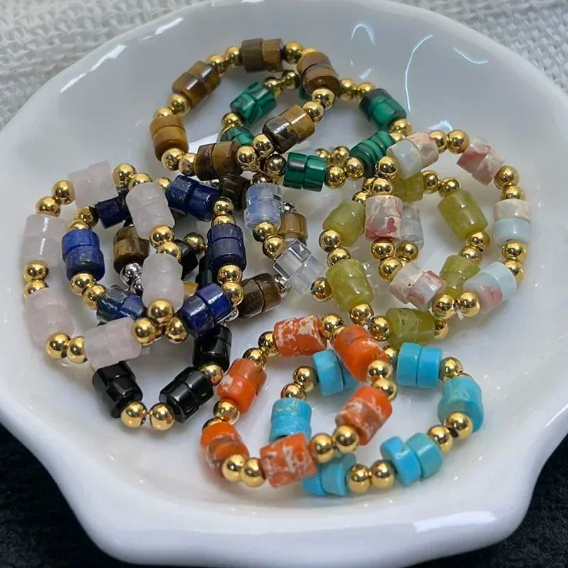Colorful beaded bracelets on a white dish