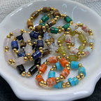 Colorful beaded bracelets on a white dish