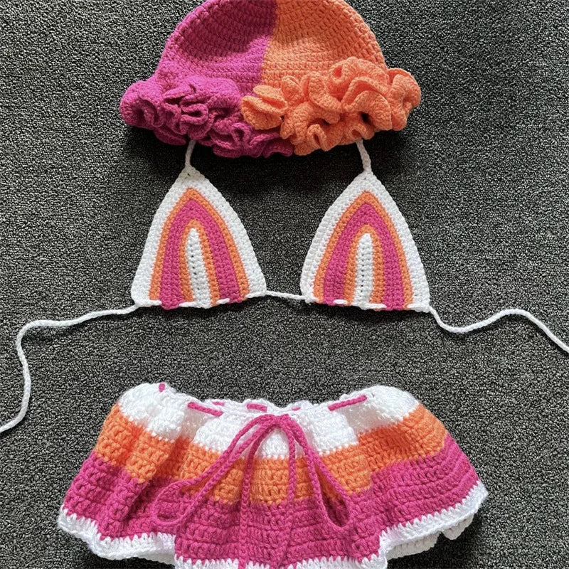 Crocheted bikini set with matching hat on a dark surface