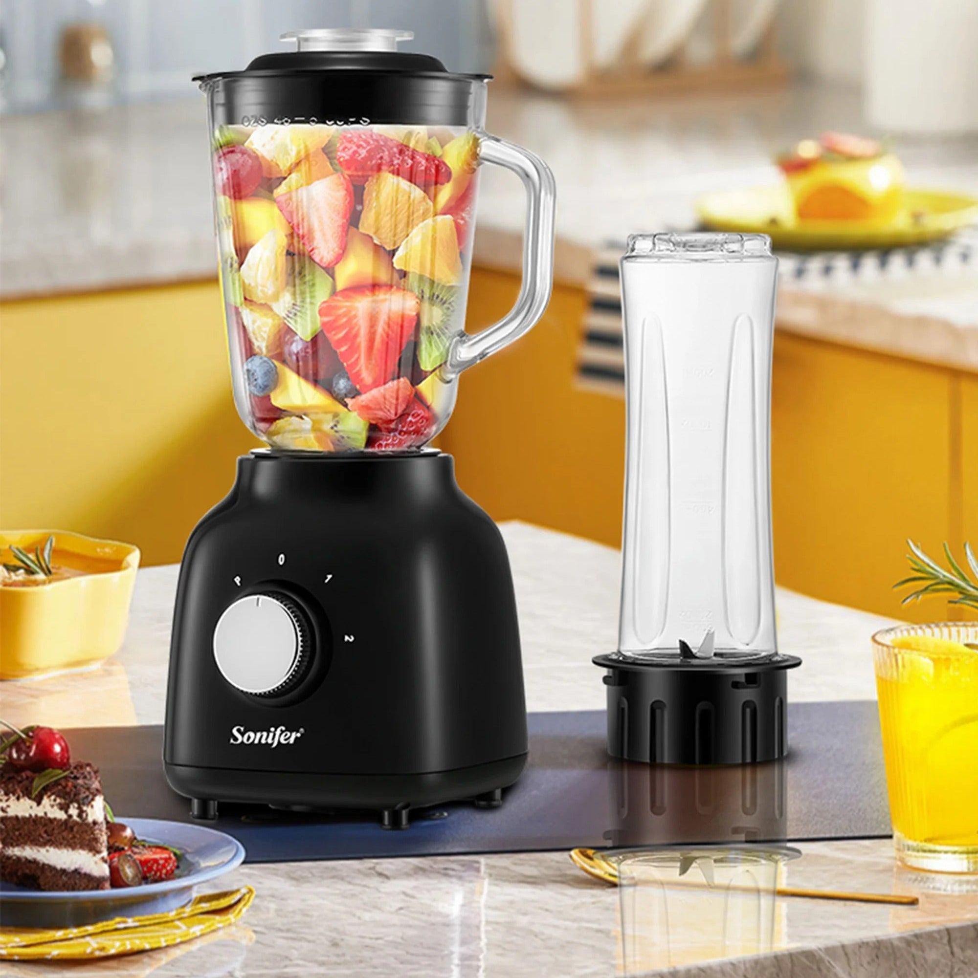 Black blender with fruit inside on a kitchen counter, featuring the Sonifer brand.