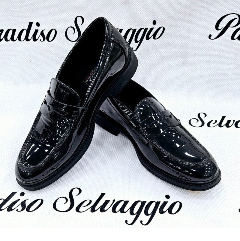Black patent leather shoes on a white background with 'Radiso Selvaggio' branding.