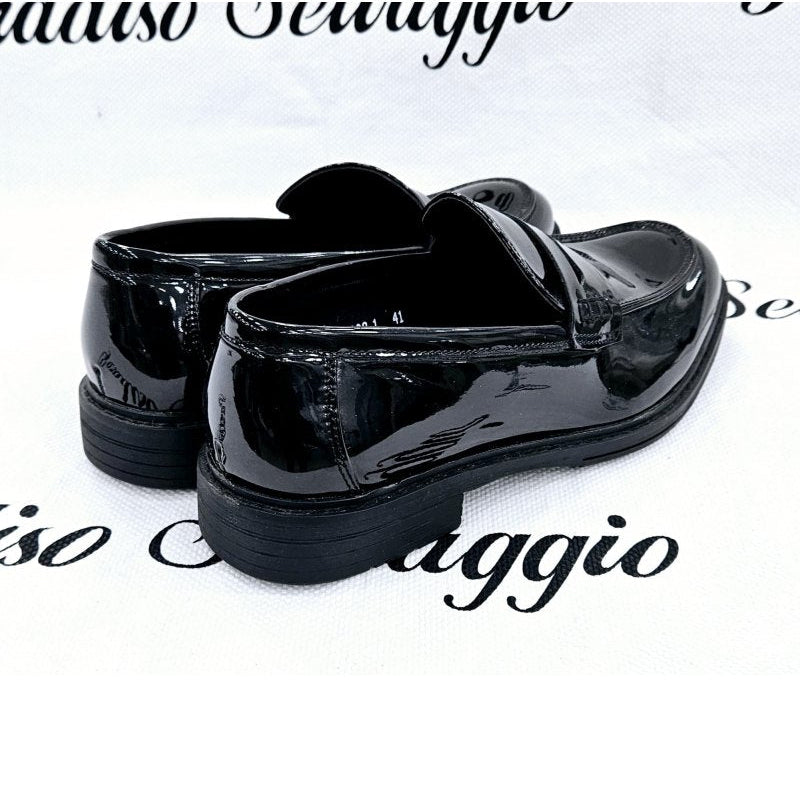 Black patent leather shoes on a white background with 'Salvo Sovaggio' branding.