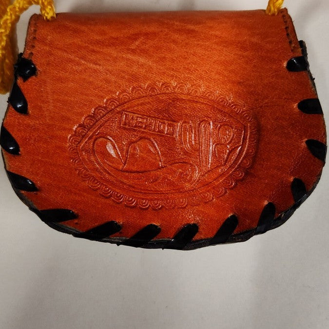Brown leather pouch with black stitching on a white background