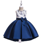 Blue and white dress with floral top and bow on a mannequin against a white background