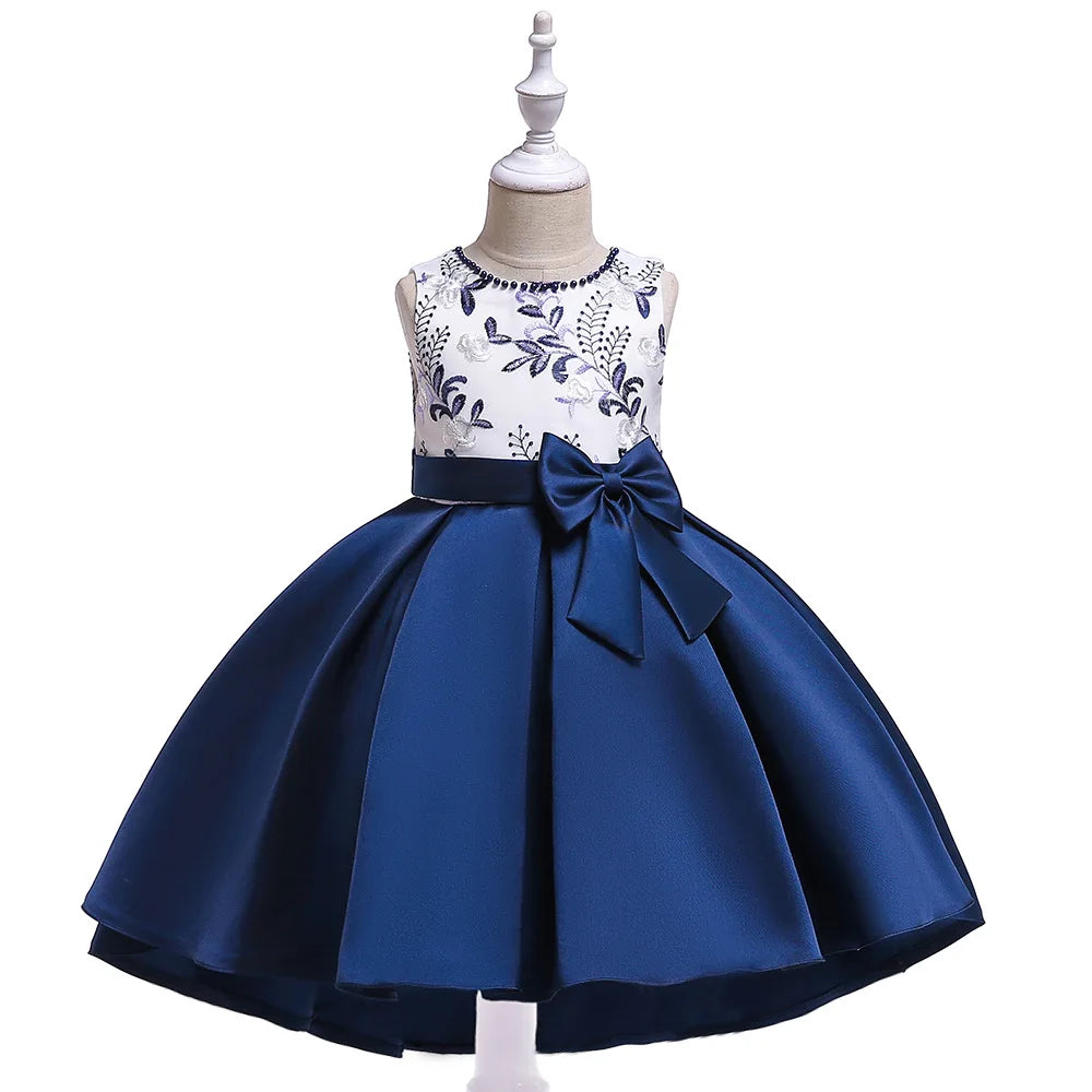 Blue and white dress with floral top and bow on a mannequin against a white background